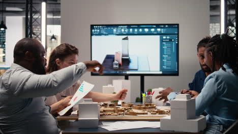 engineers and real estate developers reviewing smart city design layout