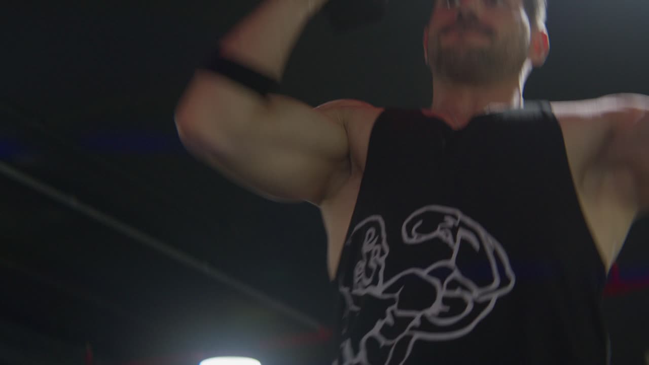 dumbell up training, lifting dumbell shoulder press intense gym workout, cinematic backlit athlete at gym hall, Medium shot