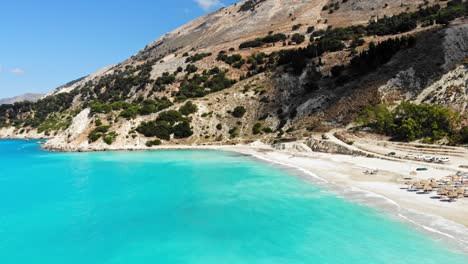 paradise sandy beach of agia kiriaki with emerald clear sea in south milos island, cyclades, greece - aerial drone shot