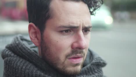 depressed man sitting in a cafe, feeling upset, worried and thinking about bad things