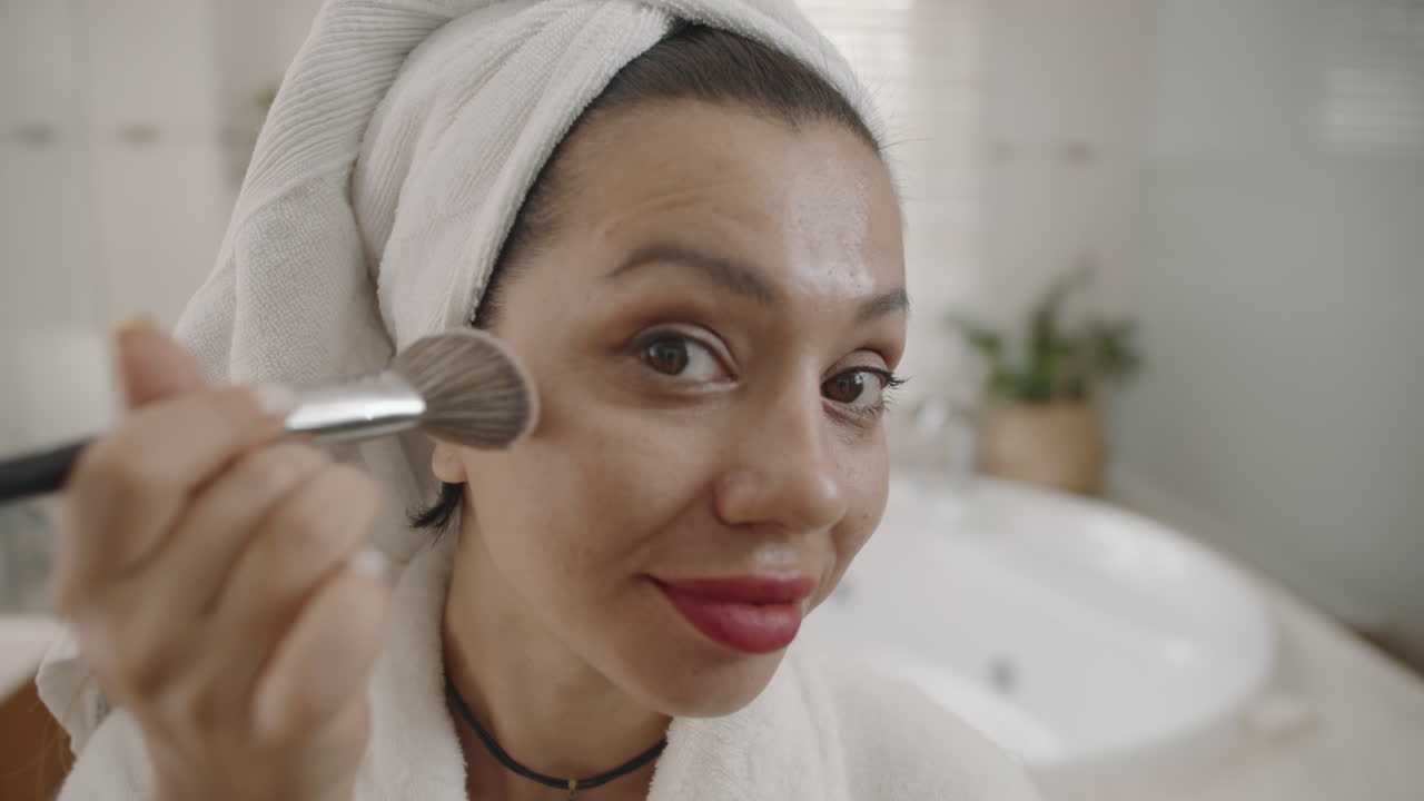 Young Caucasian Woman Doing Makeup with Brush POV