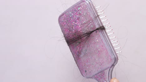pérdida de cabello en peine rosa