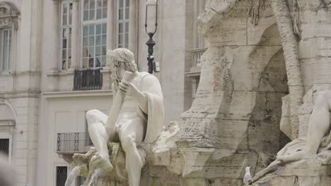 ancient roman fountain statue in piazza