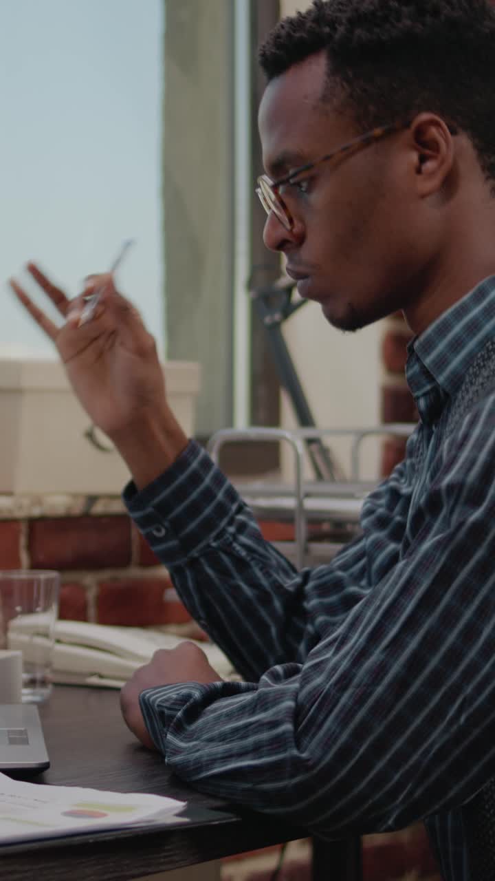 Man thinking at desk in office