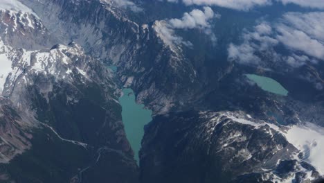 beautiful aerial view from the window seat of a plane over the rocky mountains in british columbia, canada