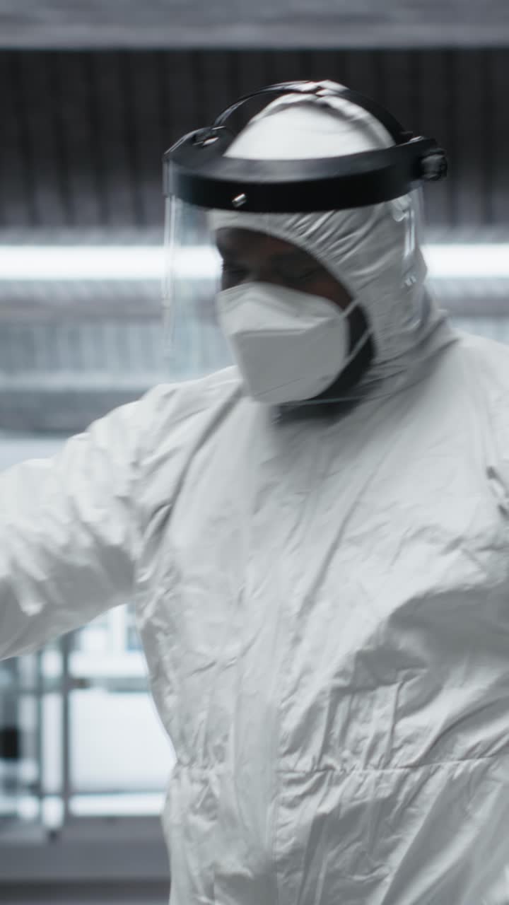 Vertical Video Medic in protective gear collecting data on infection spread