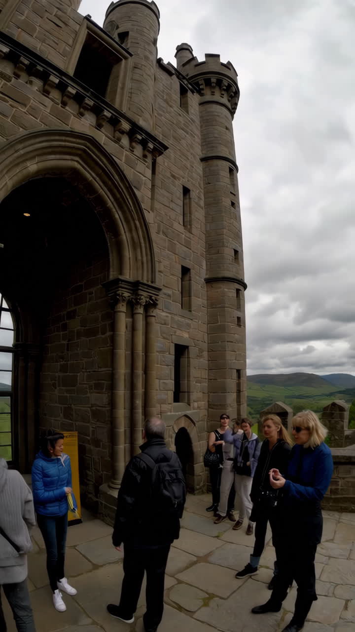 Exterior View of a Historic Castle with Tourists
