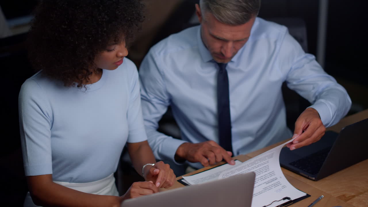 Business partners discussing terms of contract