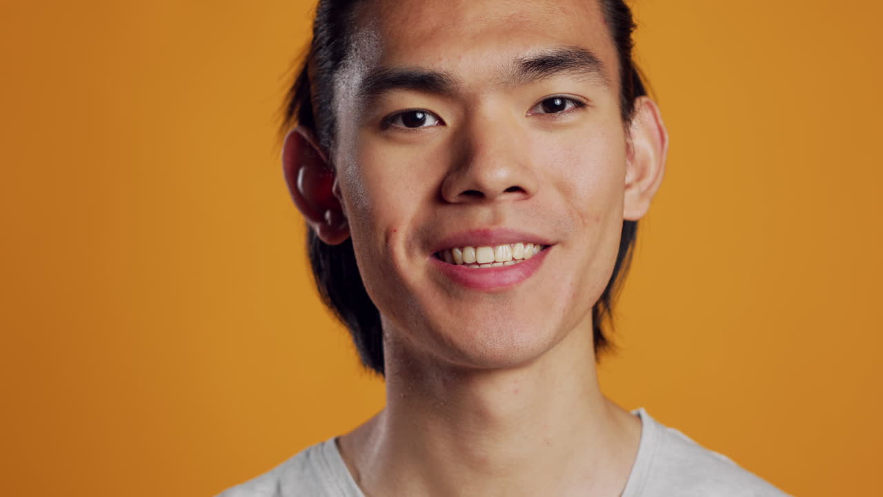 Happy man smiling and being excited on camera