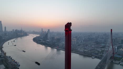 drone aerial view of sunset and the landmark bridge in shanghai china