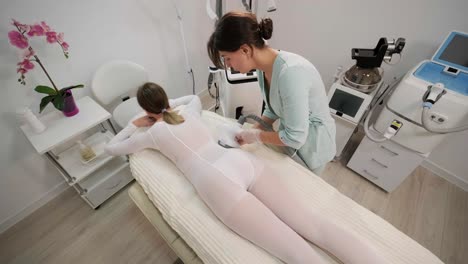 vacuum-roller body massage in the clinic of modern cosmetology