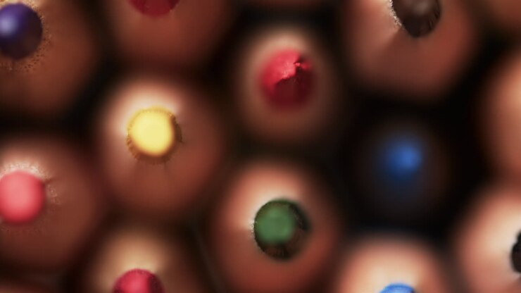 Close up of colourful pencil crayons, in slow motion