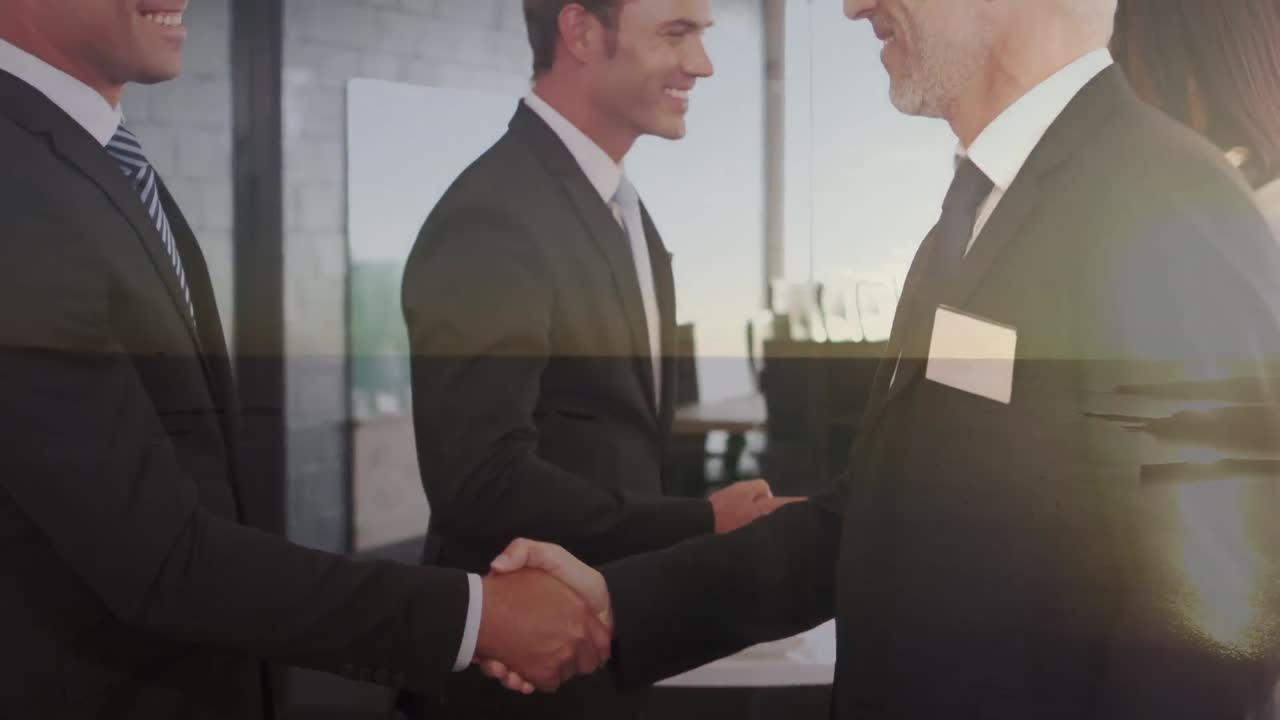 Animation of happy caucasian businessmen shaking hands over seascape