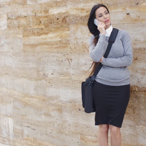 Woman-using-phone-and-waiting-on-hold