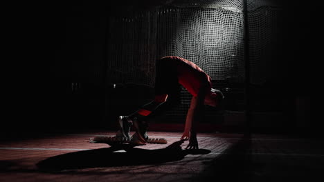 athlete in starting blocks at night