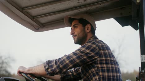 farmer driving a tractor