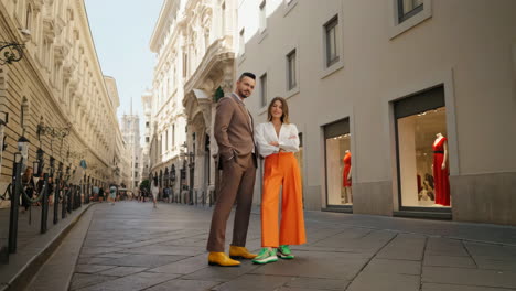 stylish couple posing on a historic european city street