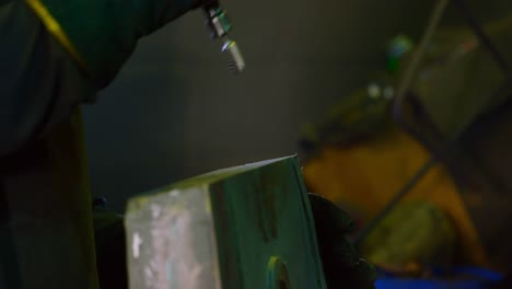 worker using pen grinder machine in workshop 4k