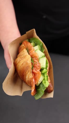 croissant sandwich with salmon and cucumber