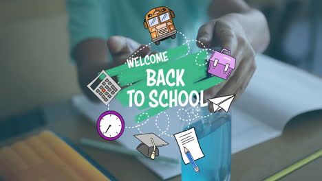 animation of words welcome back to school over boy disinfecting his hands