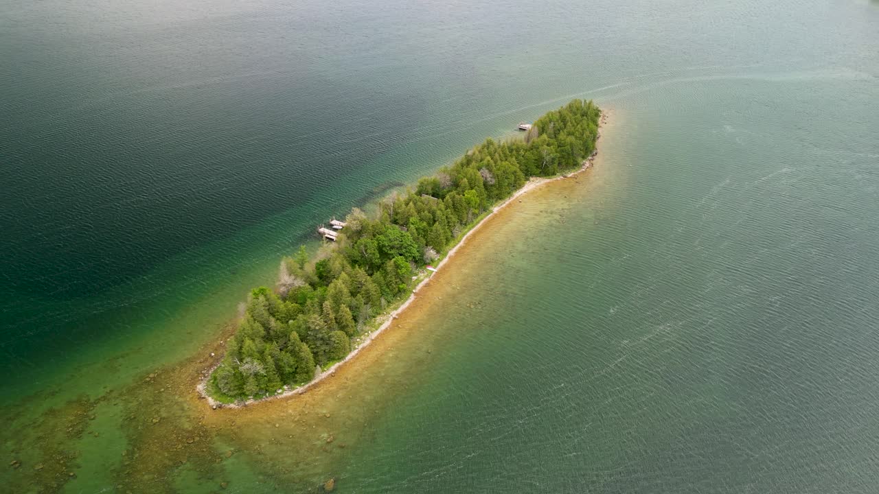 Aerial orbit of small island, hessel, michigan, les cheneaux islands