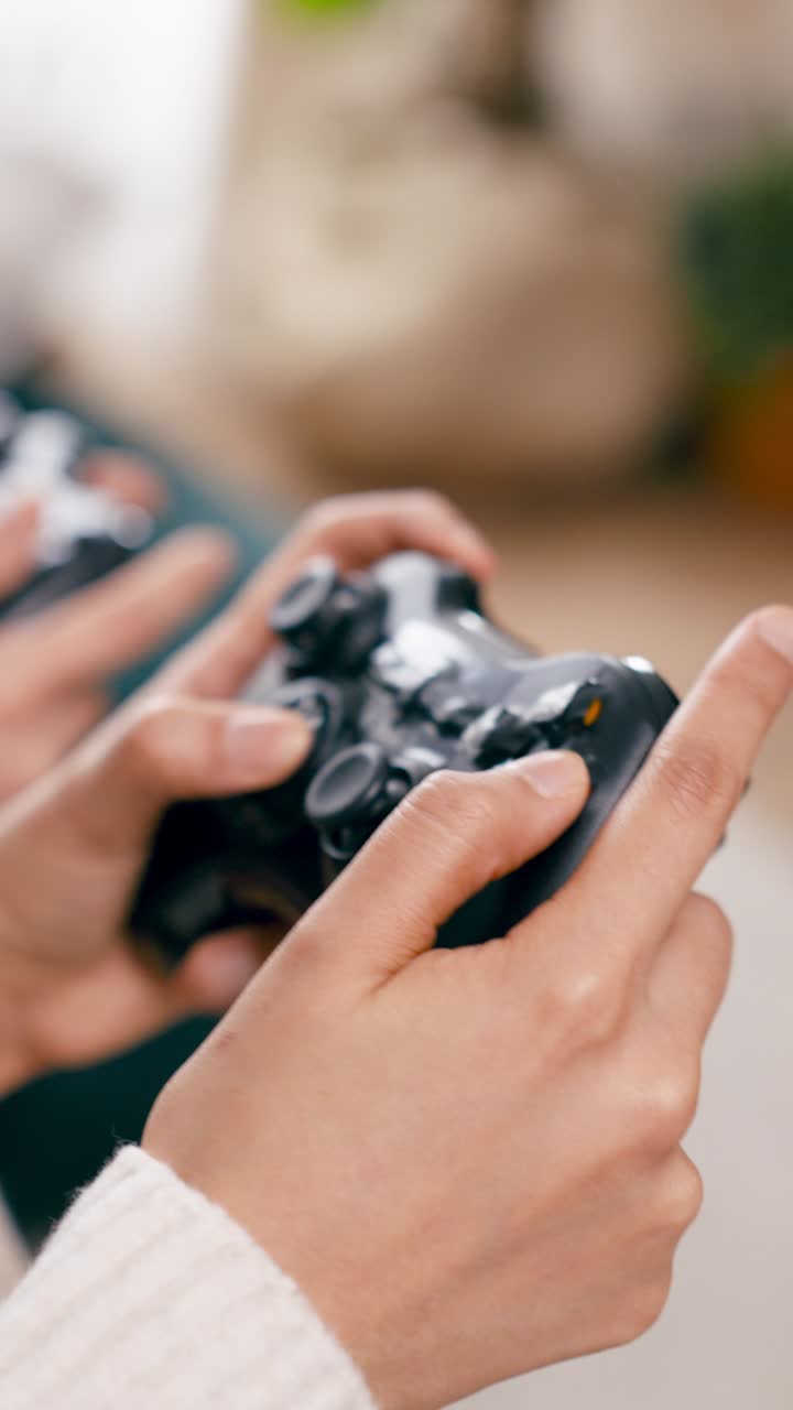 Close-up of Hands Playing Video Game with Controller
