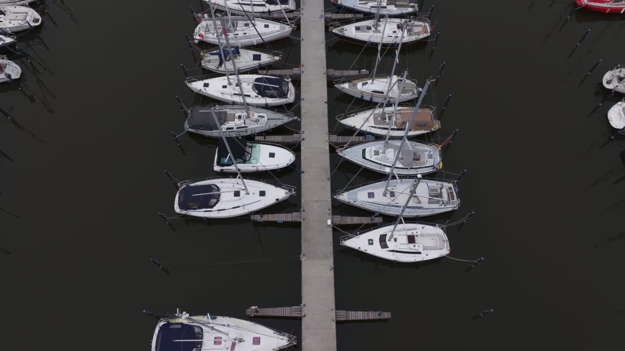 Series of sailing yachts in Makkum marina in Friesland, Netherlands
