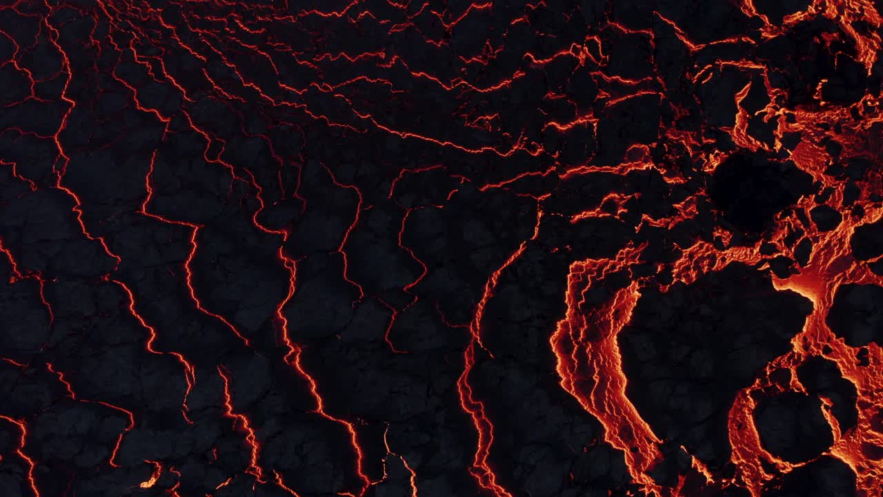 Wrinkle cracked black basalt surface on top of molten lava river, top down