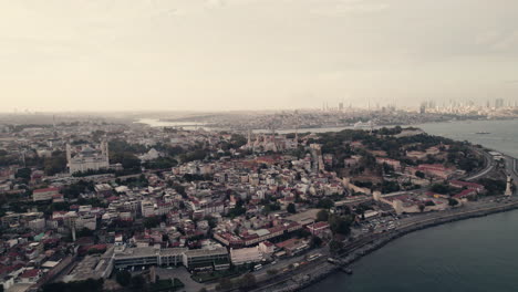 aerial view of the hagia sophia on a misty day, city and mosque around, river nearby, istanbul, slow motion and copy space