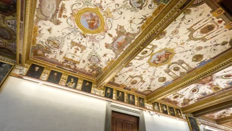 ornate ceiling with paintings and sculptures