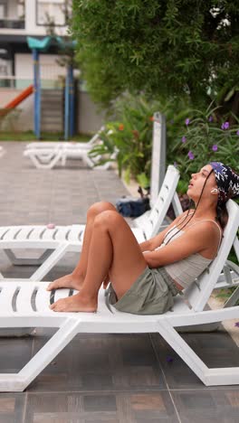 woman relaxing by the pool