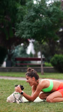 woman and her pug enjoying a fun outdoor workout session