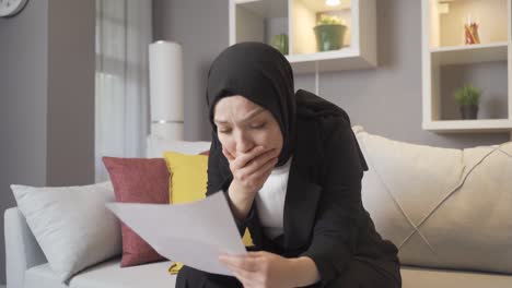 a woman in hijab who receives bad news.