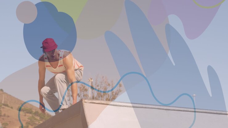 Animation of colourful shapes over caucasian man skateboarding