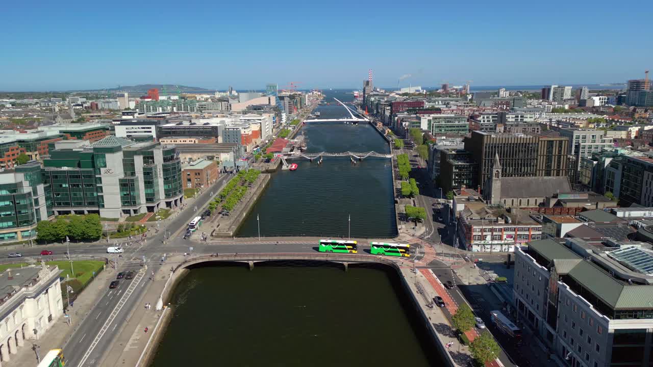 Advancing aerial video of Custom House, the River Liffey and the surrounding area in Dublin, Ireland, on a bright and sunny day. Filmed in 4K, 60FPS and with Rec709 color.