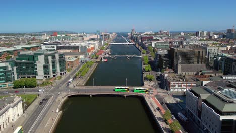 advancing aerial video of custom house, the river liffey and the surrounding area in dublin, ireland, on a bright and sunny day. filmed in 4k, 60fps and with rec709 color.