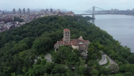 settling counterclockwise orbit of the cloisters museum in upper manhattan on the bank of the hudson river