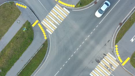 aerial view of a road intersection with crosswalks