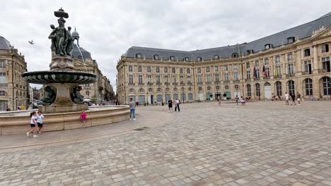 people enjoying the square and fountain area