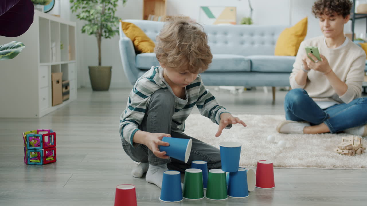 Child Playing with Stacking Cups