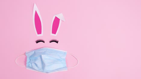 making easter bunny with face mask and blinking eye lashes. stop motion flat lay