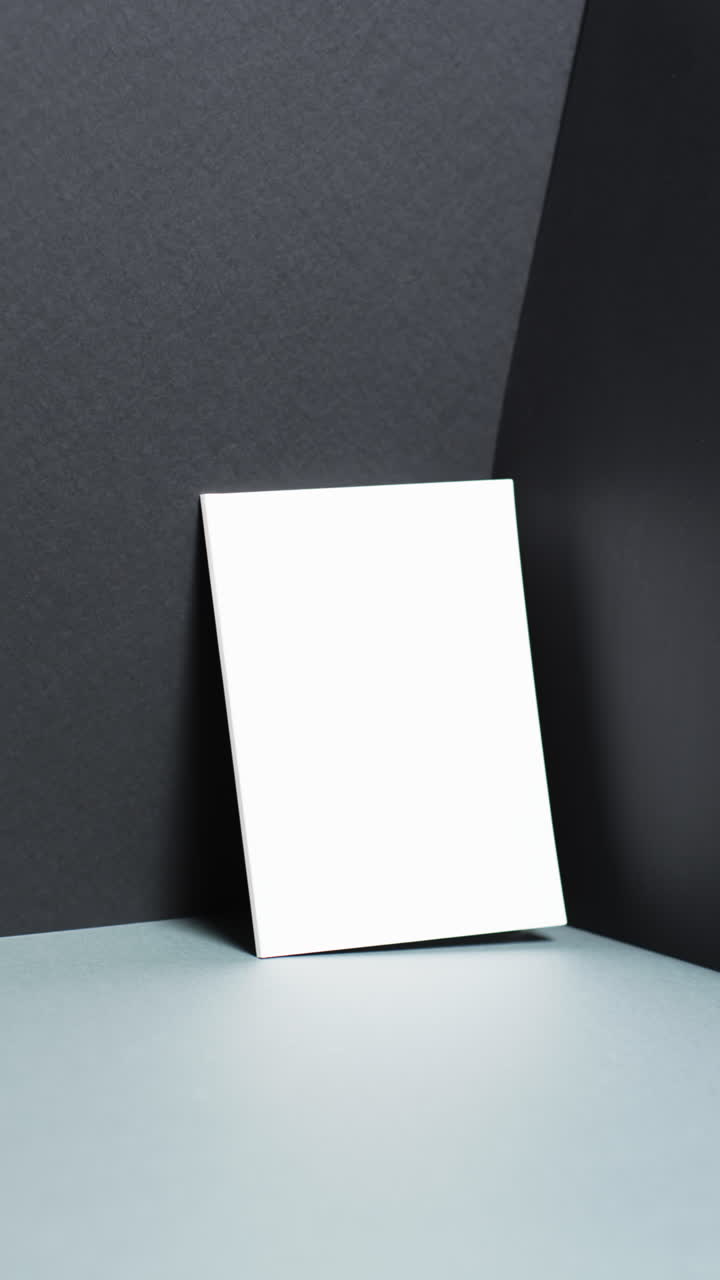 Vertical video of book with white blank pages and copy space on black background