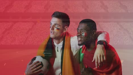 animation of confetti over diverse footballers watching game with flags of germany and portugal