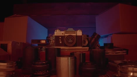 vintage cameras and equipment in a dark room