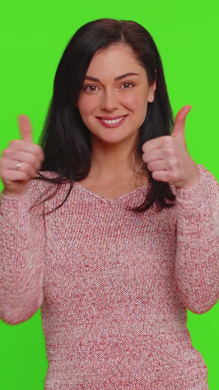 Hipster woman raises thumbs up agrees or gives positive reply recommends advertisement likes good