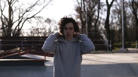 Portrait-Of-A-Handsome-Young-Man-With-Dark-Curly-Hair