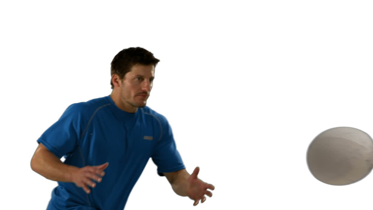 Serious rugby player catching ball