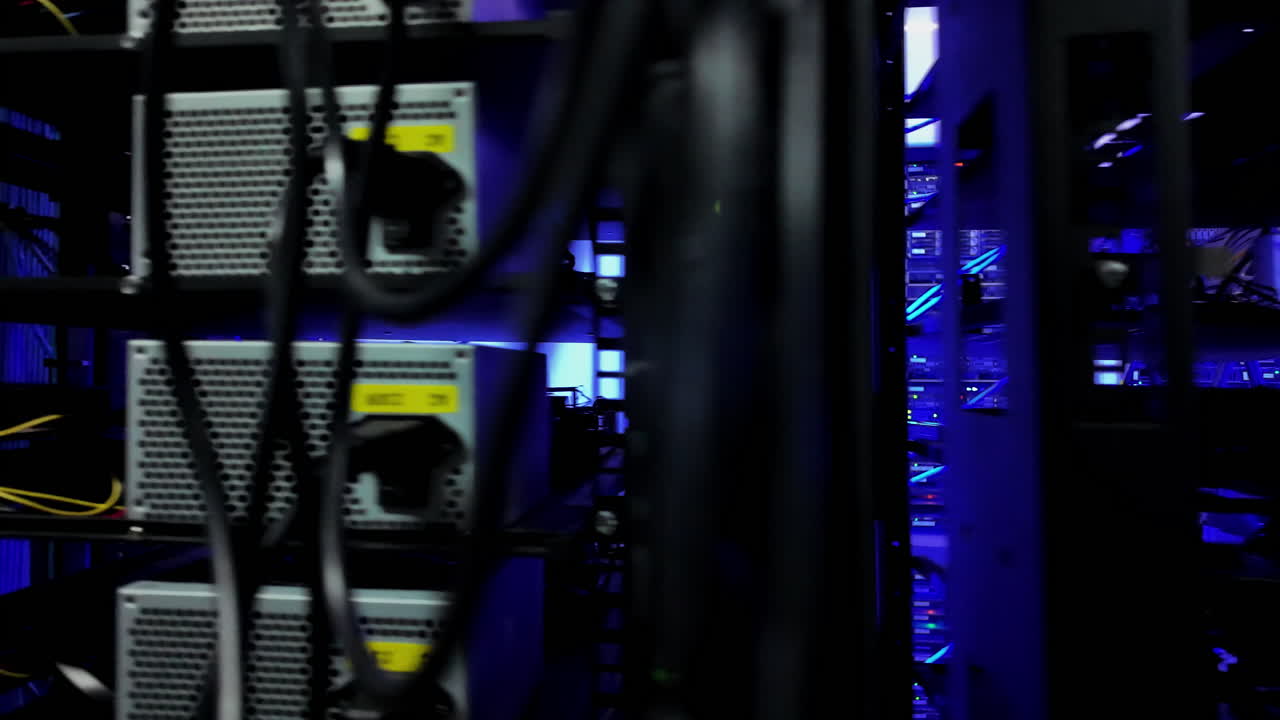 Close up of multiple rack-mounted servers in data centre