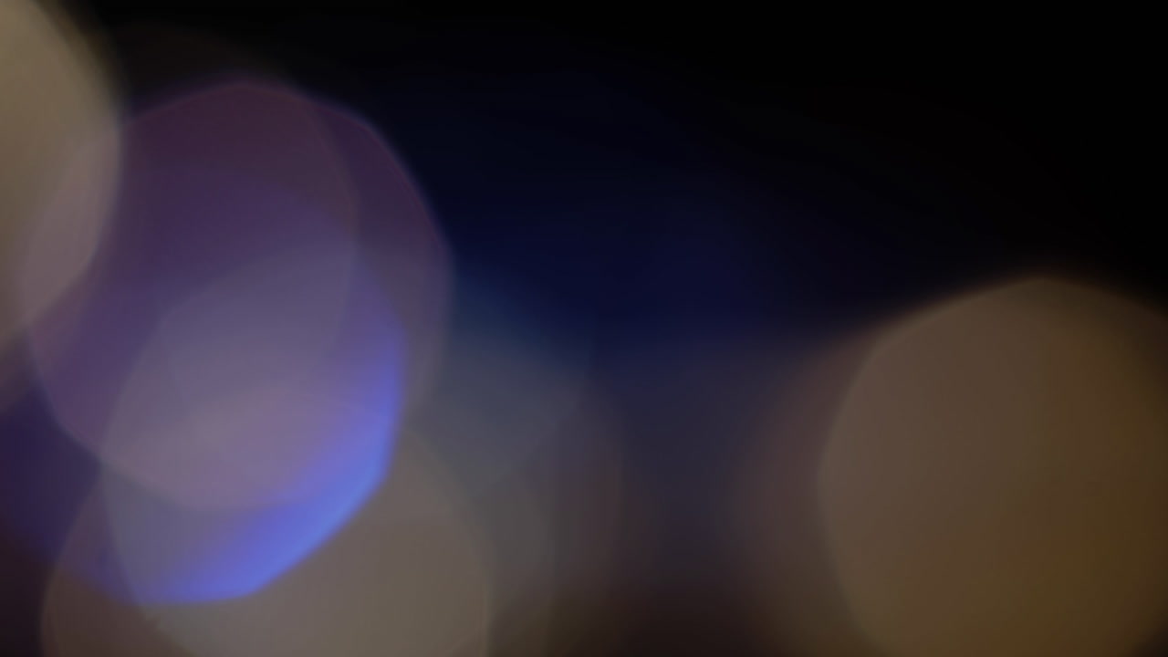 Multicolored light leaks 4k footage on black background, Stylizing video, transitions, Bokeh effect