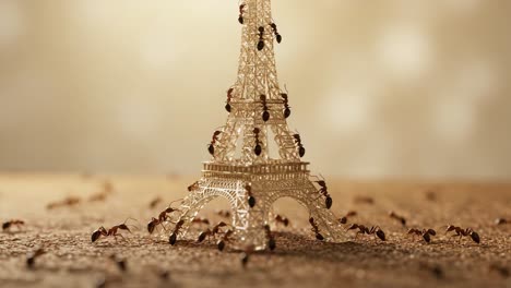 a busy colony: ants scuttle over miniature eiffel tower, showcasing their intricate behavior and strength in teamwork